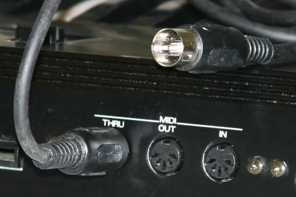 MIDI connectors and MIDI cable, showing the in, out, and thru ports plus five-pin DNI connector