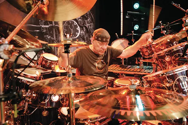 Neil Peart of Rush is one of the best drummers of all time known for his huge drum set and showmanship