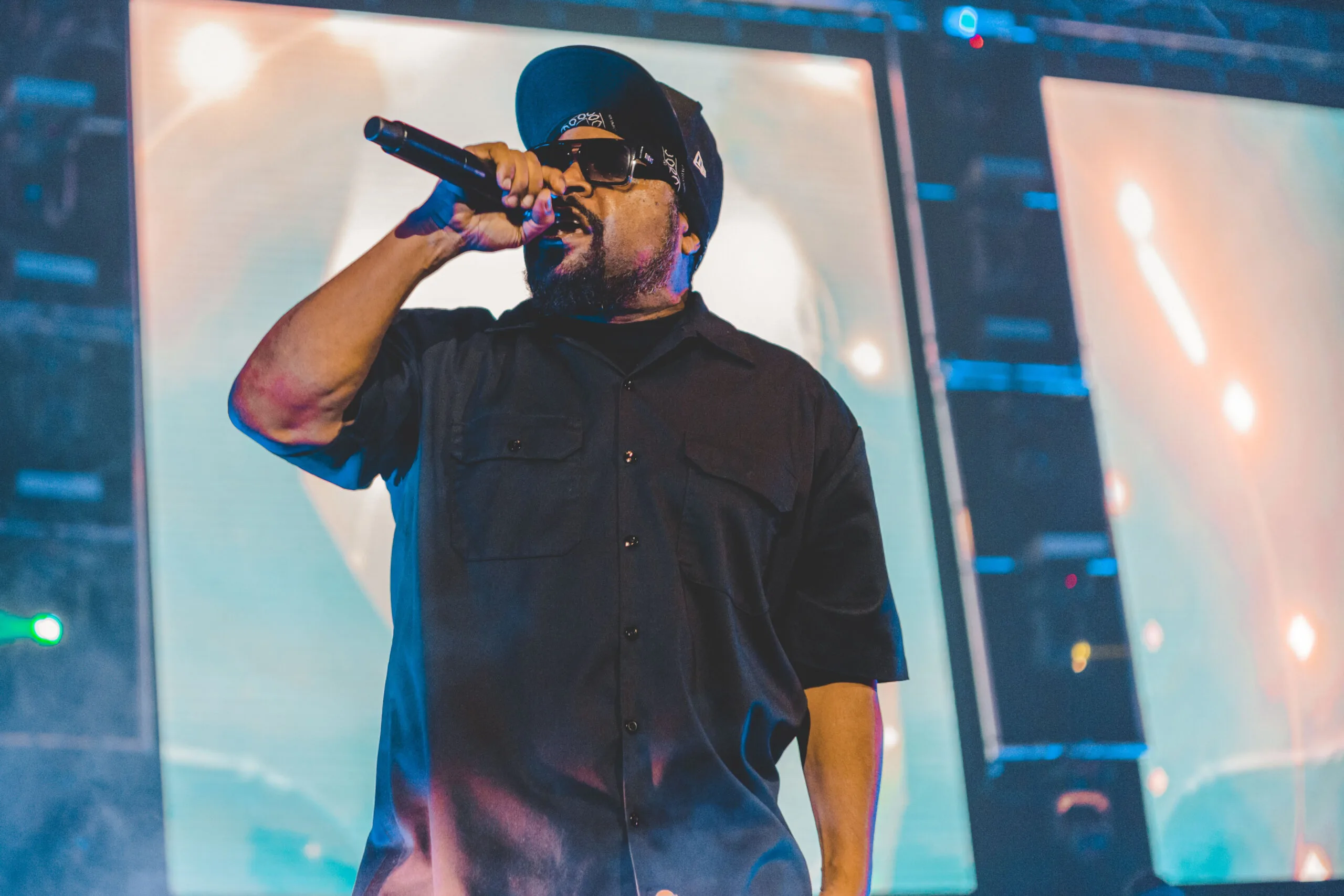 A close-up shot of the Ice Cube singing on the stage