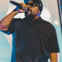 Close-up shot of the Ice Cube singing on the stage.